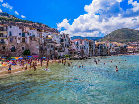 CEFALU, ITALY - JULY 15, 2014: Unidentified people on the beach in CefalÃ¹.のeditorial素材