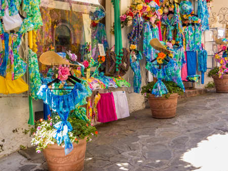 POSITANO, ITALY - JULY 17, 2016: Summer clothes on display in a street shop.のeditorial素材