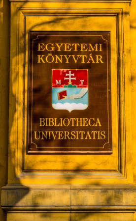 BUDAPEST, HUNGARY - NOVEMBER 18, 2016: View of the sign at the entrance of the University Library.のeditorial素材