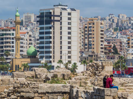 SIDON, LEBANON - MAY 21, 2017: Arabic couple sitting on the ruins of the Sidon Sea Castle.のeditorial素材