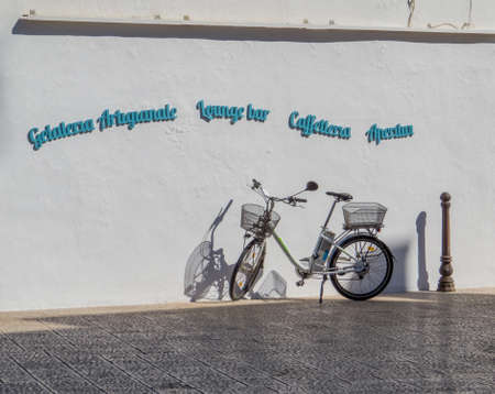 OTRANTO, ITALY - JULY 17, 2017: Bicycle parked in front of a "gelateria" (ice-cream shop) in the old town.のeditorial素材