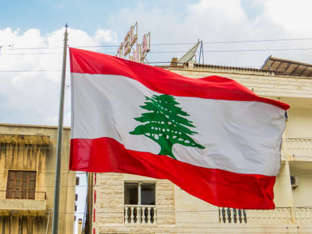 BEIRUT, LEBANON - NOVEMBER 5, 2017: Lebanese flag in front of the Cable Car in Jounieh.のeditorial素材