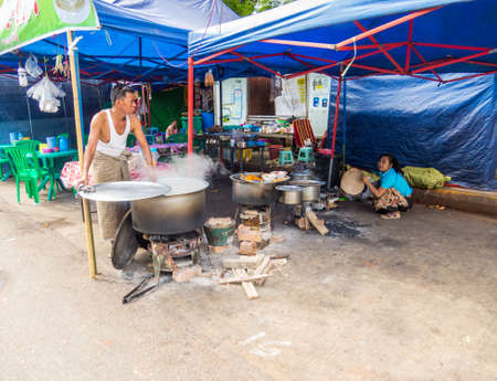 YANGON, MYANMAR - JANUARY 4, 2018: Traditional Burmese street restaurant.のeditorial素材