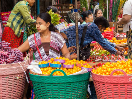 YANGON, MYANMAR - JANUARY 4, 2018: Colorful street market in the city center.のeditorial素材
