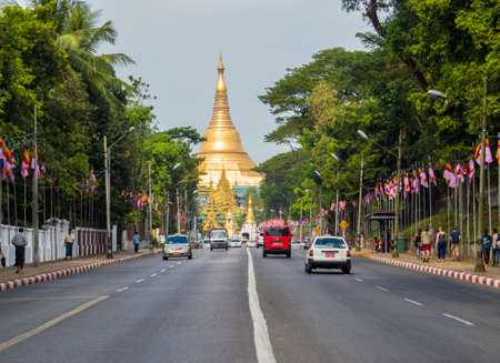 YANGON, MYANMAR - JANUARY 4, 2018: View of the Shwedagon Pagoda road with the Shwedagon Pagoda itself in the background.のeditorial素材