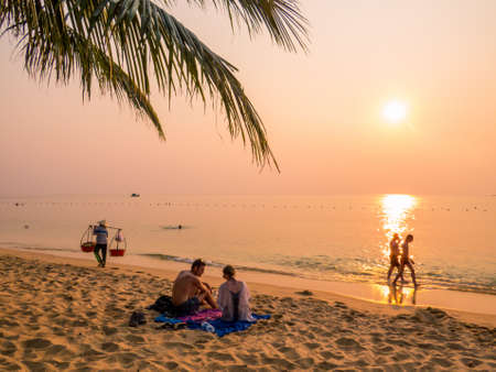 PHU QUOC, VIETNAM - FEBRUARY 6, 2018: People on the popular Long Beach at sunset.のeditorial素材