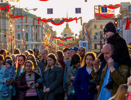 ST. PETERSBURG, RUSSIA - MAY 9, 2018: People attending street concert on Nevsky Prospect on Victory Day (commemoration of the surrender of Nazi Germany in 1945).のeditorial素材