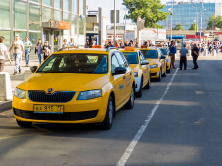MOSCOW, RUSSIA - MAY 27, 2018: "New Yellow Taxis" in front of the  Kursky railway station.のeditorial素材