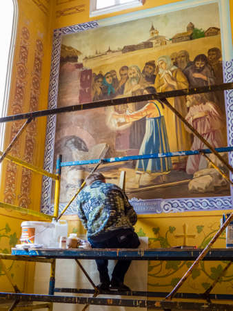CHELYABINSK, RUSSIA - JUNE 5, 2018: Man working at the restoration of frescoes in the St. Simeon Cathedral.のeditorial素材