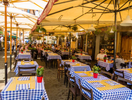 ROME, ITALY - JULY 26, 2018: Traditional Roman restaurant in Piazza Campo de' Fiori.のeditorial素材