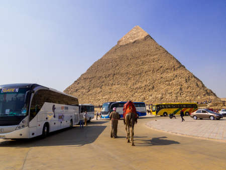 Cairo, Egypt - November 1, 2019: Tourist buses in front of the Pyramid of Khafre on the Giza necropolis.のeditorial素材