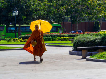 Phnom Penh, Cambodia - January 9, 2020: Buddhist monk walking in the old town.のeditorial素材