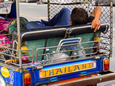 Bangkok, Thailand - January 16, 2020: Tuc Tuc driver resting in the old town.のeditorial素材
