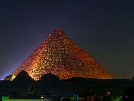 Cairo, Egypt - November 31, 2019: View of the Great Pyramid of Giza illuminated at night.のeditorial素材