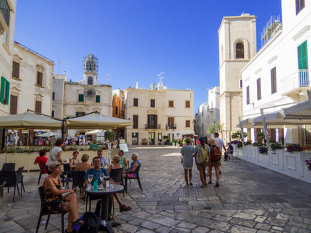 Polignano a Mare, Italy - August 6, 2021: View of the Clock Square (Italian: Piazza dell'Orologio) in the old town.のeditorial素材