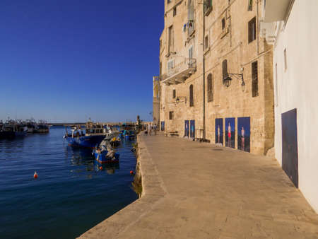 Monopoli, Italy - August 7, 2021: View of the port in the old town.のeditorial素材