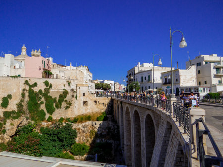 Polignano a Mare, Italy - August 6, 2021: View of the Bourbon Bridge in the old town.のeditorial素材