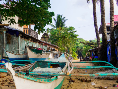Traditional Filipino fisherman boat in San Fernando Beach in El Nido, Palawan, Philippinesの写真素材