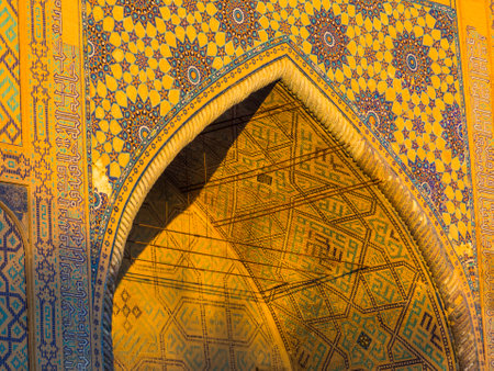 Sunrise on Ulugh Bek Madrassah in Registan Square in Samarkand, Uzbekistanの写真素材