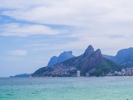 View of the Two Brothers Hill and the Vidigal favela as seen from Ipanema Beach. In Rio de Janeiro, Brazilの写真素材