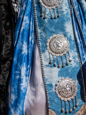 Traditional Clothes of Lijiang on sale in a shop in the old town. In Lijiang, Yunnan, China