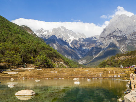 View of the Blue Moon Valley and the Jade Dragon Snow Mountain (or Yulong Snow Mountain). In Lijiang, Yunnan, Chinaの写真素材