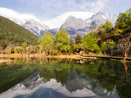View of the Blue Moon Valley and the Jade Dragon Snow Mountain (or Yulong Snow Mountain). In Lijiang, Yunnan, Chinaの写真素材