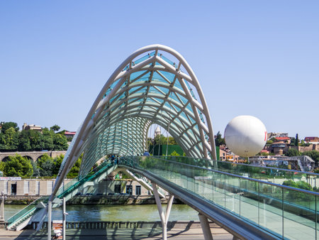 View of the Bridge of Peace crossing the Kura river. In Tbilisi, Georgiaの写真素材