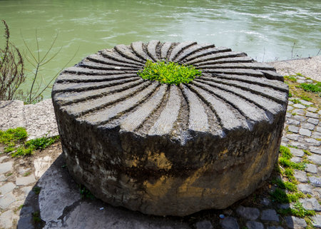 Ancient mill on the embankment of the Tiber River in Rome, Italyの写真素材