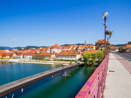 View of the old town from the Main Bridge, crossing the Drava River. In Maribor, Sloveniaの写真素材