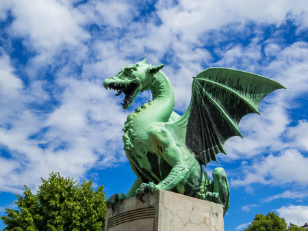 Statue on the Dragon Bridge. In Ljubljana, Sloveniaの写真素材