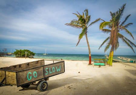 Wood Cart with Go Slow message at Caye Caulker - Belizeの写真素材