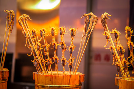 Scorpions and seahorses on a stick - typical chinese foodのeditorial素材