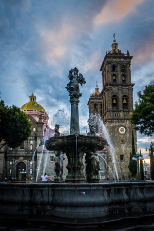 Fountain and Puebla Cathedral at sunset - Puebla, Mexicoのeditorial素材