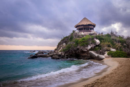 Sunset and beach hut at Cape San Juan - Natural Tayrona National Park, Colombia