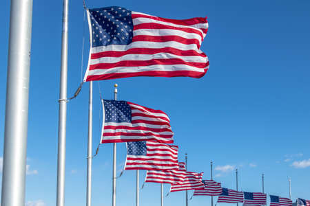 Many American Flags Waving at Washington Monument - Washington, DC, USAの写真素材
