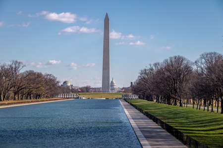 Washington Monument and pool reflection - Washington, DC, USAの写真素材