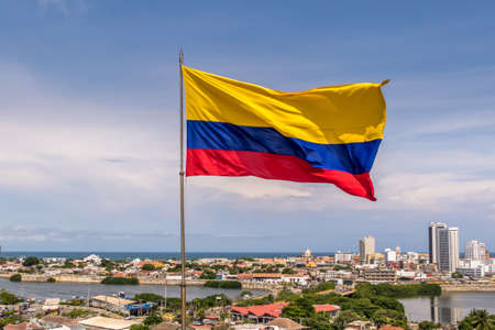 Colombian Flag over city of Cartagena, Colombiaの写真素材