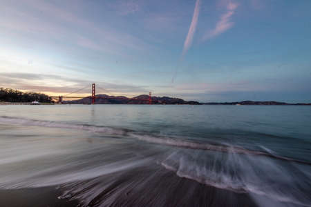 Beach and Golden Gate beach at sunset - San Francisco, California, USAの写真素材
