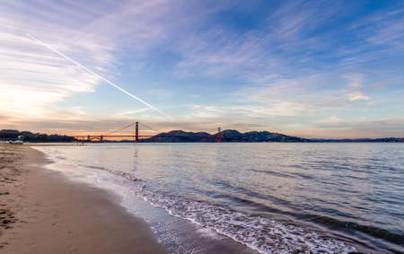 Beach and Golden Gate beach at sunset - San Francisco, California, USAの写真素材