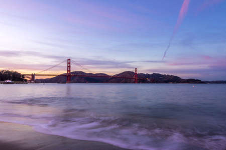 Beach and Golden Gate beach at sunset - San Francisco, California, USA