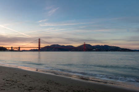 Beach and Golden Gate beach at sunset - San Francisco, California, USAの写真素材