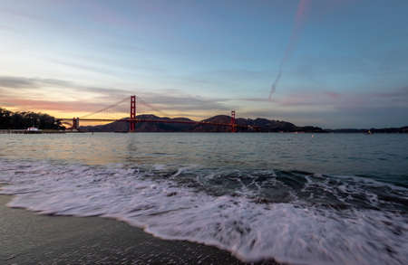 Beach and Golden Gate beach at sunset - San Francisco, California, USAの写真素材