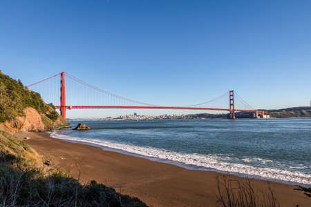 Beach view of Golden Gate Bridge and city Skyline - San Francisco, California, USAの写真素材