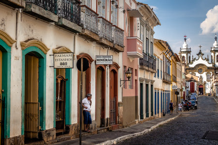 Street view of Sao Joao del Rei with Nossa Senhora do Carmo Church on backgound - Sao Joao Del Rei, Minas Gerais, Brazilのeditorial素材