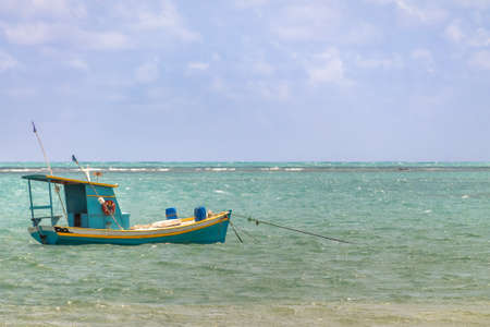 Small Fishing boat in brazilian coast - Pirangi, Rio Grande do Norte, Brazilの写真素材