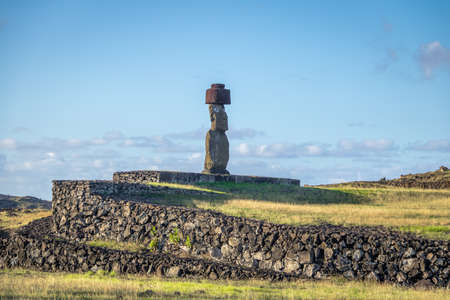 Ahu Tahai Moai Statue wearing topknot with eyes painted near Hanga Roa - Easter Island, Chileの写真素材