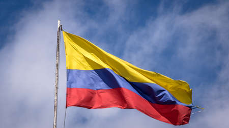 Waving Colombian Flag on a Blue Sky - Bogota, Colombiaの写真素材
