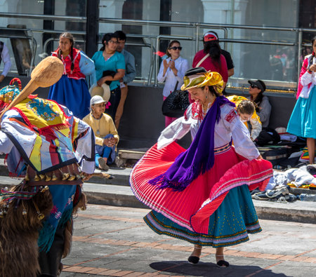 Group in local costume performing ecuadorian traditional dance - Quito, Ecuadorのeditorial素材