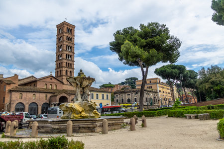 Tritons fountain and Basilica of Saint Mary in Cosmedin (Santa Maria in Cosmedin) at Piazza Bocca della Verita (Mouth of the Truth) - Rome, Italyのeditorial素材